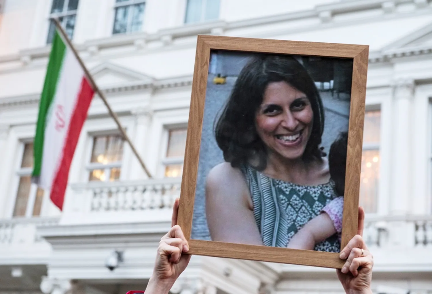 Supporters hold a photo of Nazanin Zaghari-Ratcliffe during a vigil for British-Iranian mother imprisoned in Tehran outside the Iranian Embassy on January 16, 2017 in London, England. (Getty Images)