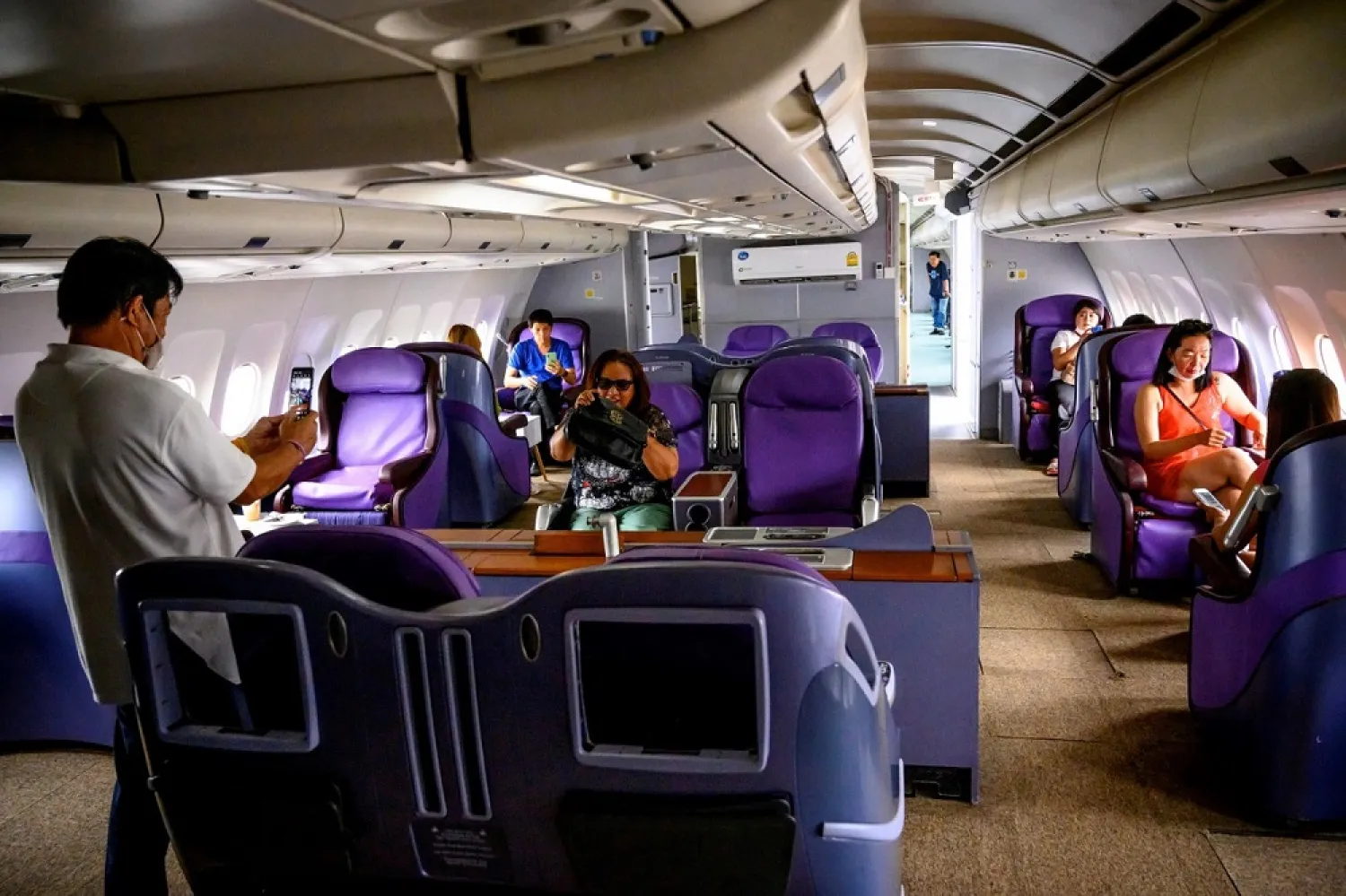 This photo taken on September 1, 2020 shows visitors enjoying business class seats in a retired Airbus 330 turned into a coffee shop at an attraction site, outside Pattaya in Chonburi province. (AFP)