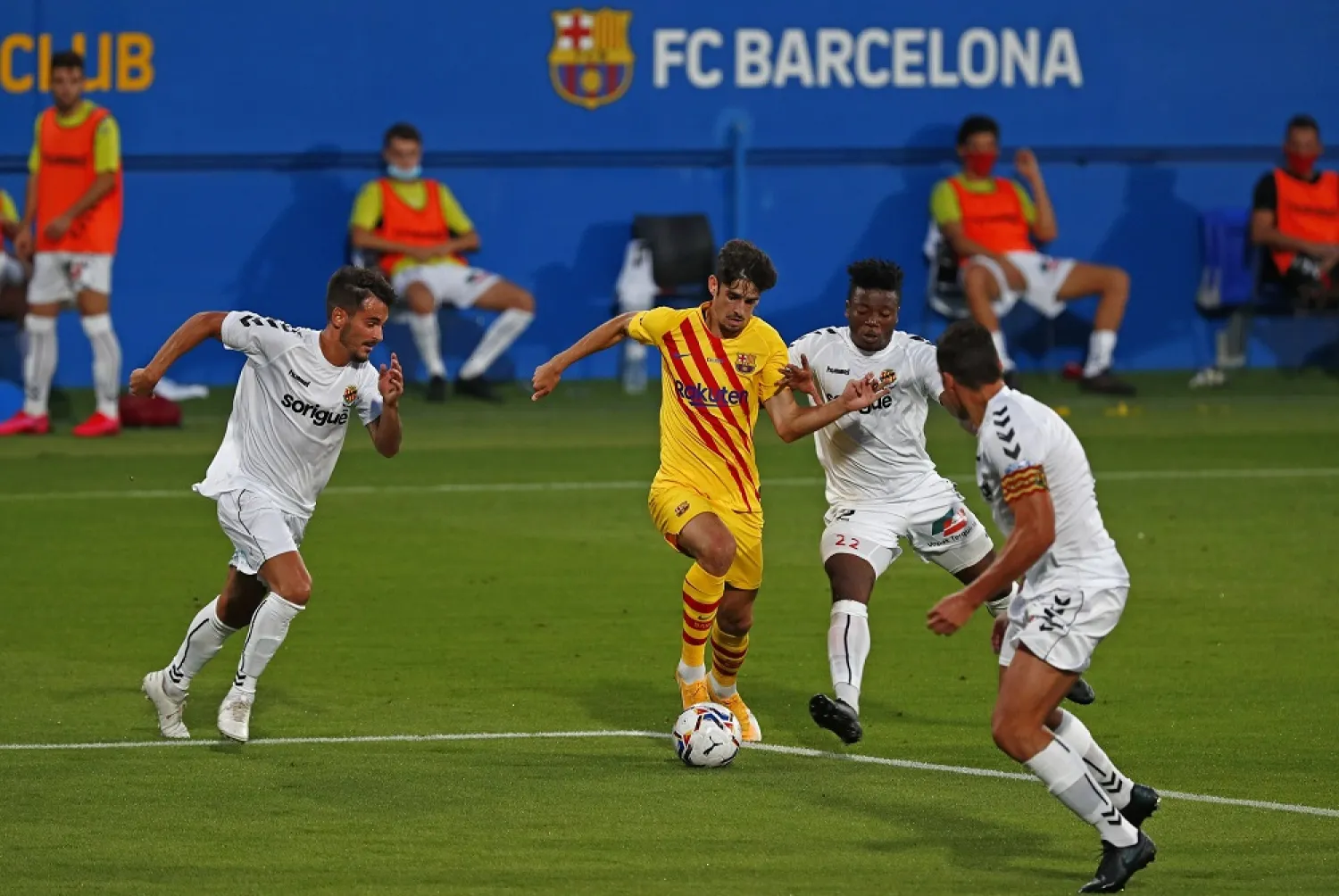 Barcelona's Trincao, center, in action during the pre-season friendly match between Barcelona and Gimnastic at the Johan Cruyff Stadium in Barcelona, Spain, Saturday, Sept.12, 2020. (AP)