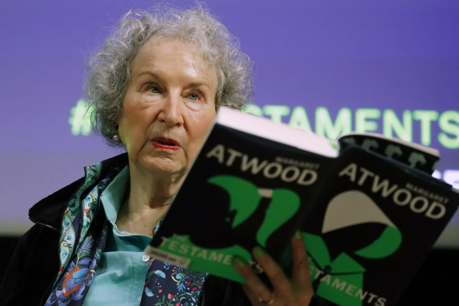 In this Sept. 10, 2019, file photo, Canadian author Margaret Atwood holds a copy of her book ‘The Testaments,’ during a news conference in London. (AP)