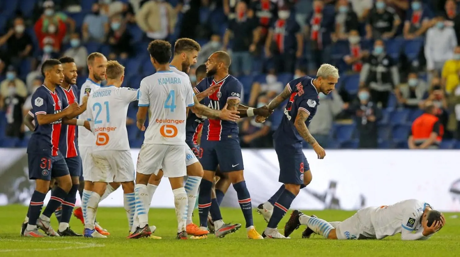PSG and Marseille players clash near the end of the French League One match at the Parc des Princes in Paris, France, Sunday, Sept.13, 2020. (AP)