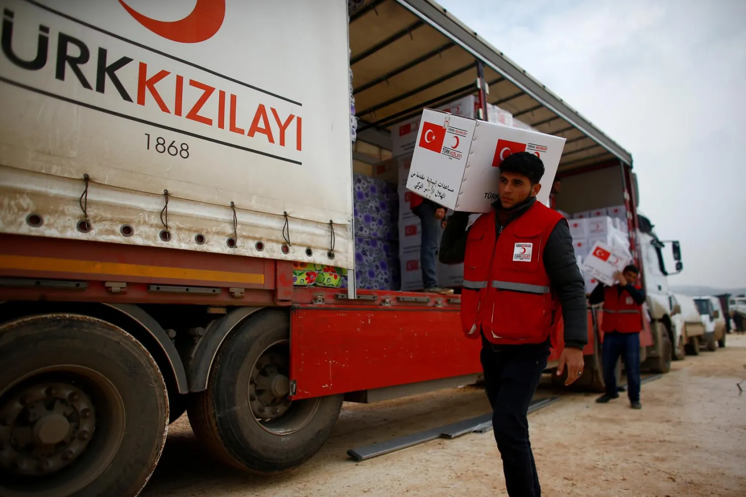Turkish Red Crescent workers carry humanitarian aid in Idlib province, Syria. Reuters file photo