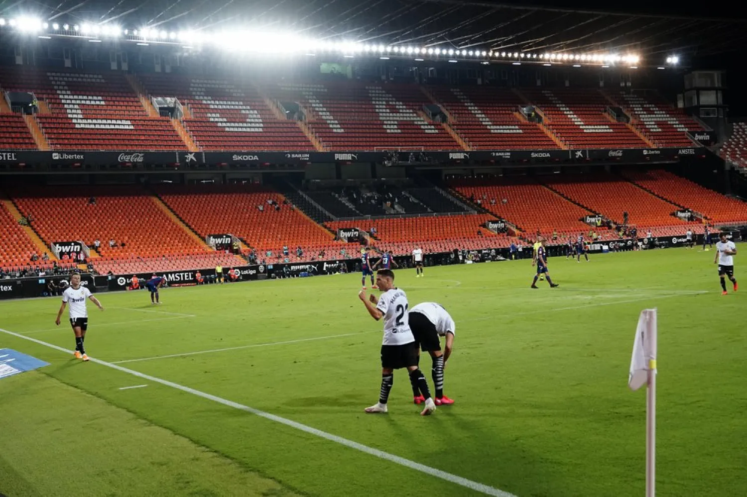 Valencia's Manu Vallejo celebrates scoring his side's 4rd goal during the Spanish La Liga match between against Levante at the Mestalla Stadium in Valencia, Spain, Sunday, Sept. 13, 2020. (AP)
