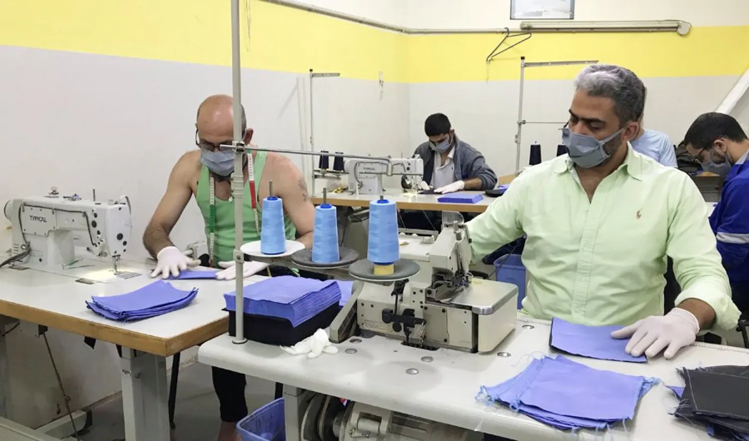 Inmates produce protective face masks, as part of the preventive measures against the spread of the coronavirus, inside Roumieh prison, Lebanon, in this handout received by Reuters on April 6, 2020. (Reuters)