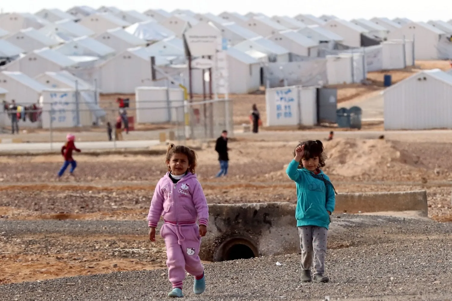 Young Syrian refugees stand at the Azraq refugee camp in northern Jordan on January 30, 2016. (AFP)