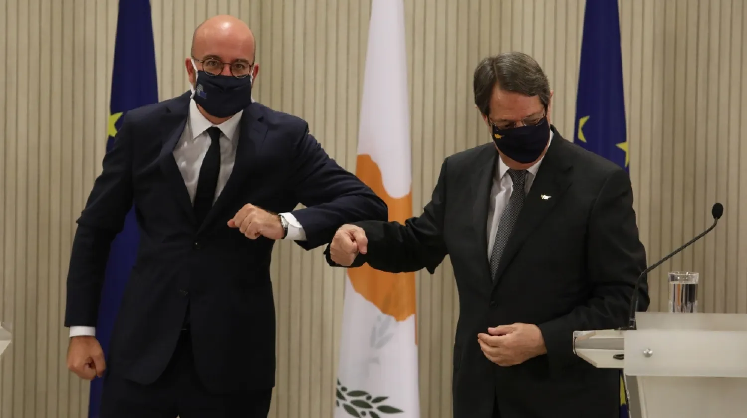 Cypriot President Nicos Anastasiades and European Council President Charles Michel bump elbows after the news conference at the Presidential Palace in Nicosia, Cyprus September 16, 2020. (Reuters)