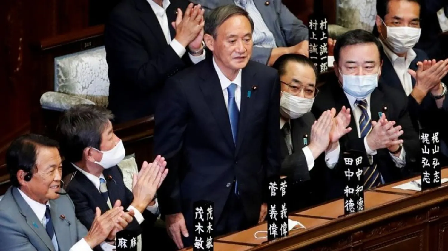 Japan's newly-elected Prime Minister Yoshihide Suga stands as he was chosen as new prime minister at the Lower House of Parliament in Tokyo, Japan September 16, 2020. (Reuters)