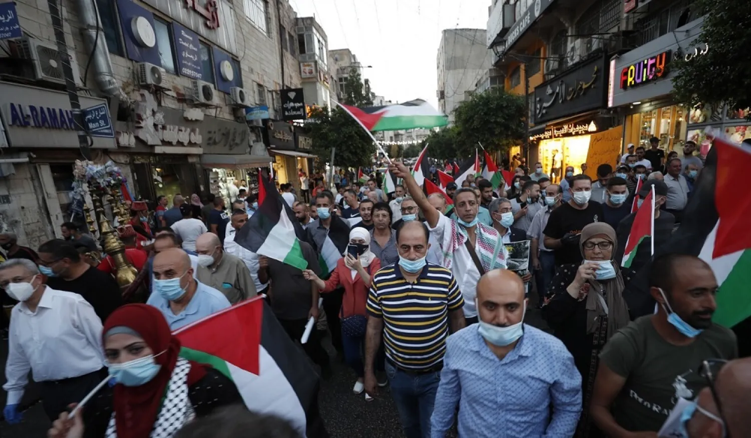 Palestinians protest against the peace agreement between Israel and the UAE in the West Bank city of Ramallah on Tuesday. (EPA)