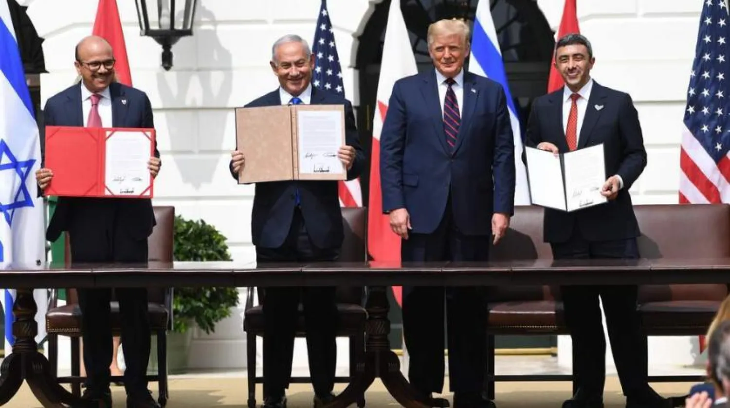 Bahrain FM Dr. Abdul Latif al-Zayani, Israeli PM Benjamin Netanyahu, US President Donald Trump, and UAE Foreign Minister Abdullah bin Zayed participate in the signing of the Abraham Accords. (AFP)
