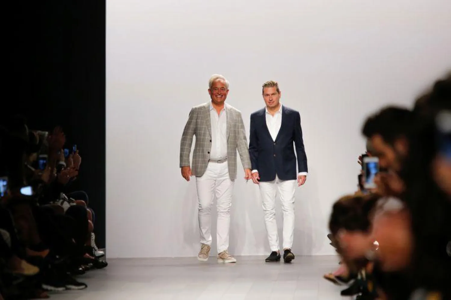 FILE PHOTO: Designers Mark Badgley and James Mischka great the crowd at the end of their Spring Summer 2018 collection show during New York Fashion Week in New York, U.S., September 12, 2017. REUTERS/Eduardo Munoz/File Photo
