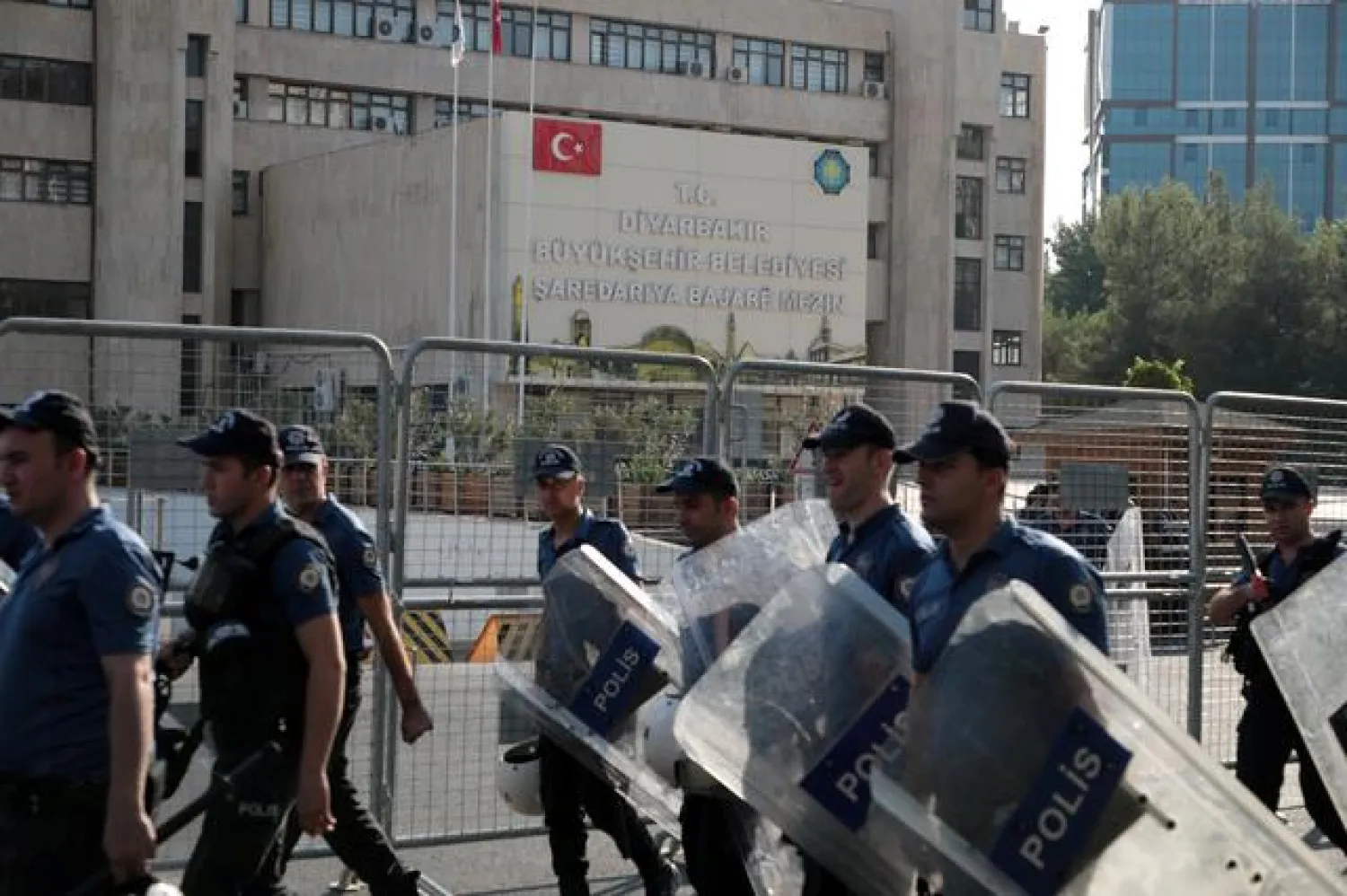Turkish police walk in front of the Metropolitan Municipality headquarters in Diyarbakir, Turkey, August 19, 2019. REUTERS/Murad Sezer
