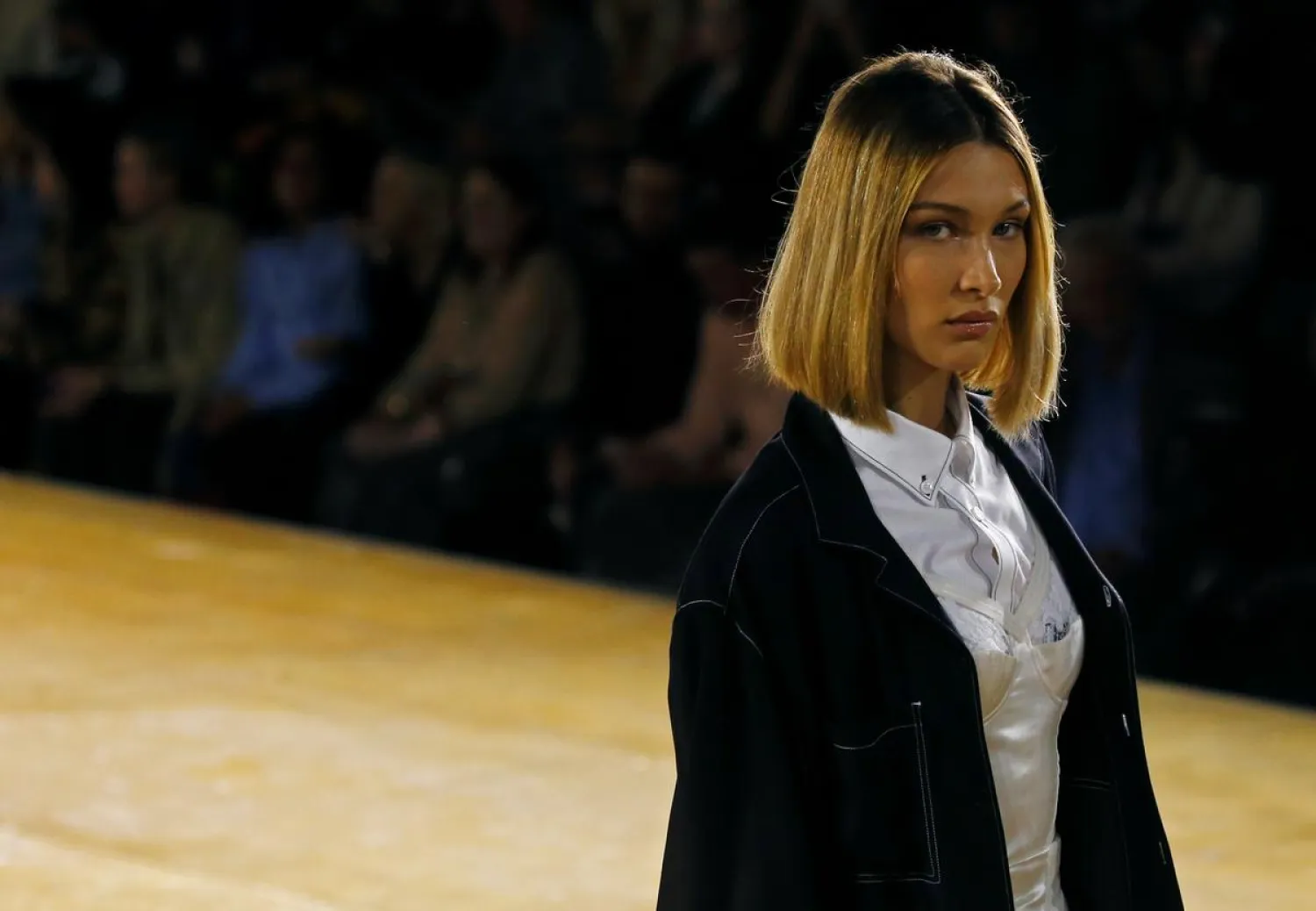 Model Bella Hadid presents a creation during the Burberry catwalk show at London Fashion Week in London, Britain, September 16, 2019. REUTERS/Henry Nicholls
