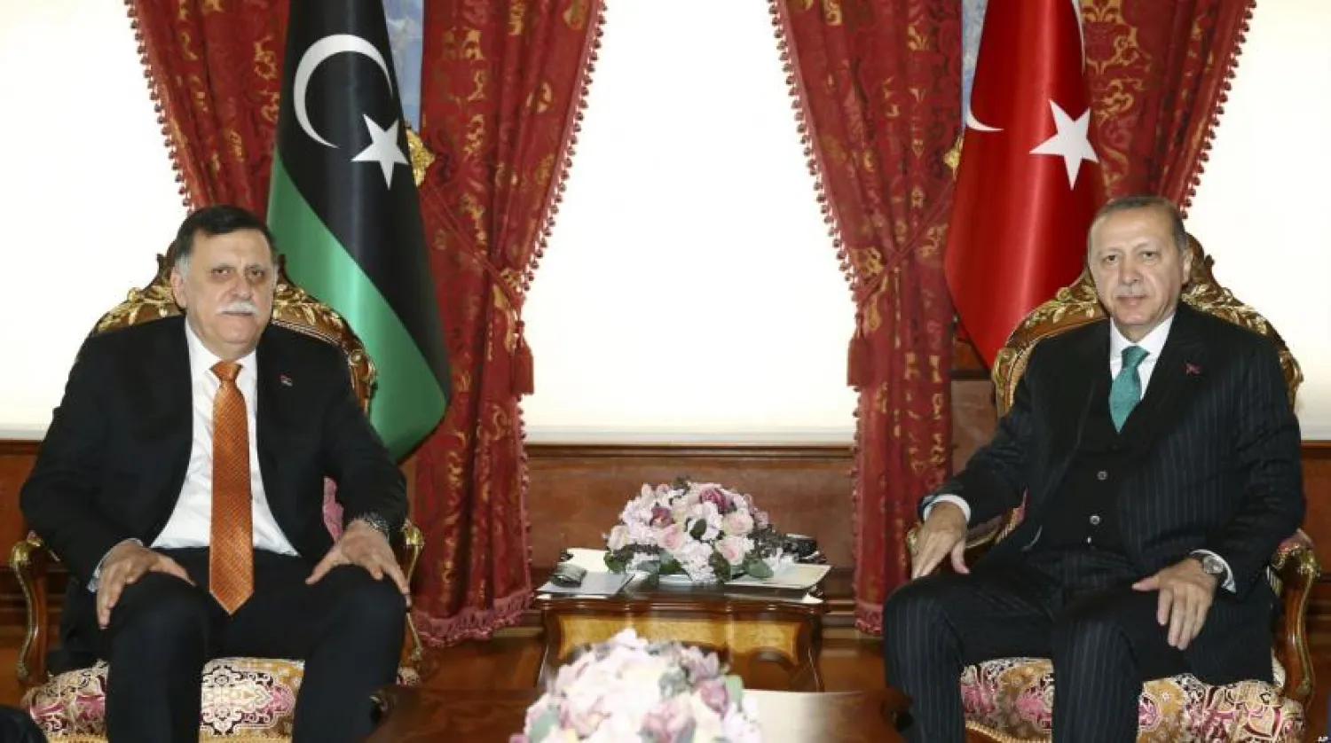 FILE: Turkish President Recep Tayyip Erdogan, right, and Fayez al-Sarraj, the head of the Libyan National Accord Government, pose for a photo during a meeting in Istanbul, Monday, Feb. 26, 2018. (Kayhan Ozer/Pool Photo via AP)
