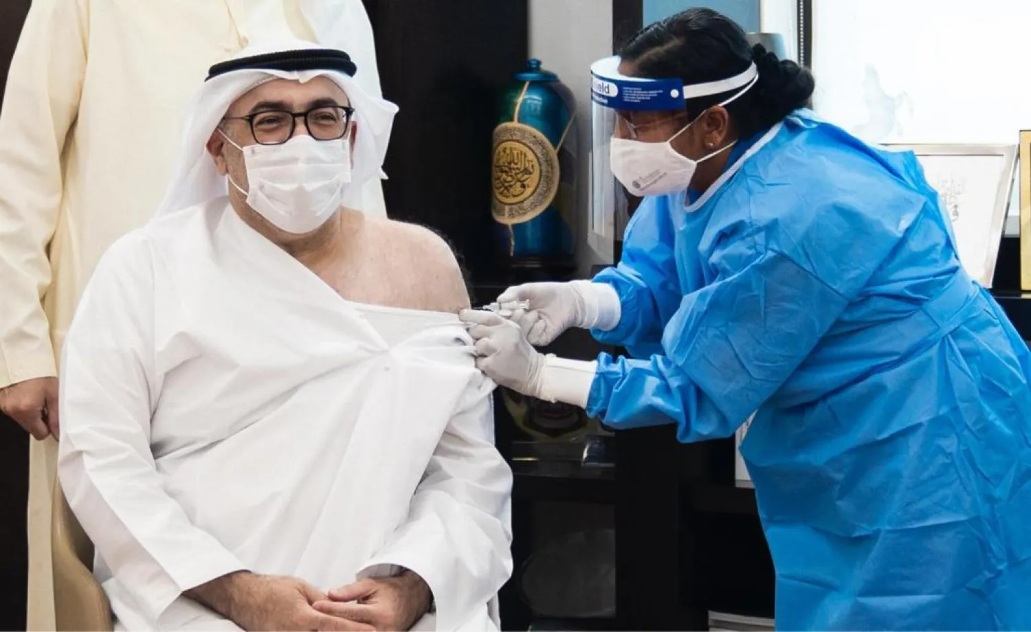 UAE health minister Abdul Rahman al-Owais receives the coronavirus vaccine. (WAM)