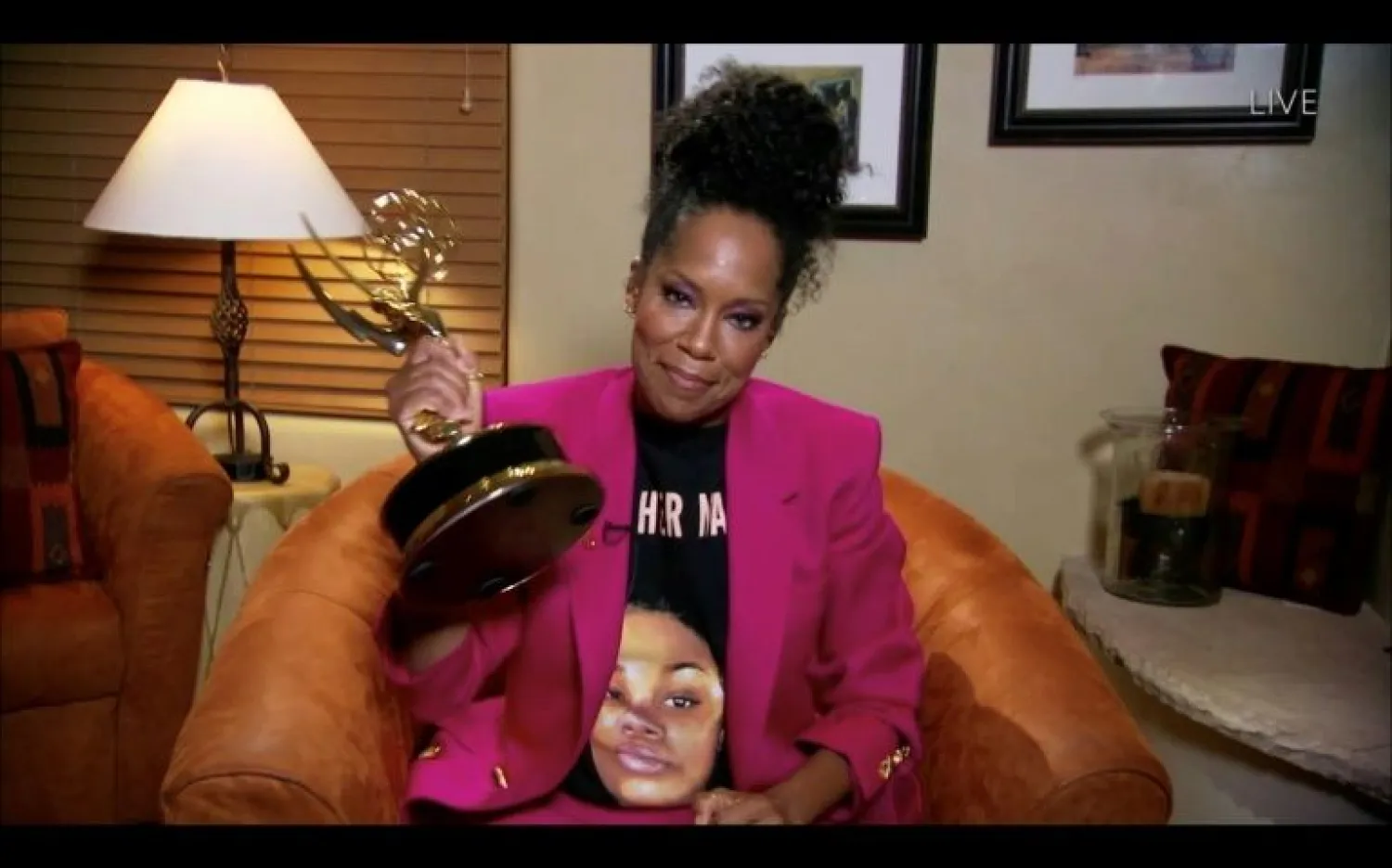 Regina King claimed her Emmy for "Watchmen" in a pink suit -- and a Breonna Taylor tee-shirt | AFP