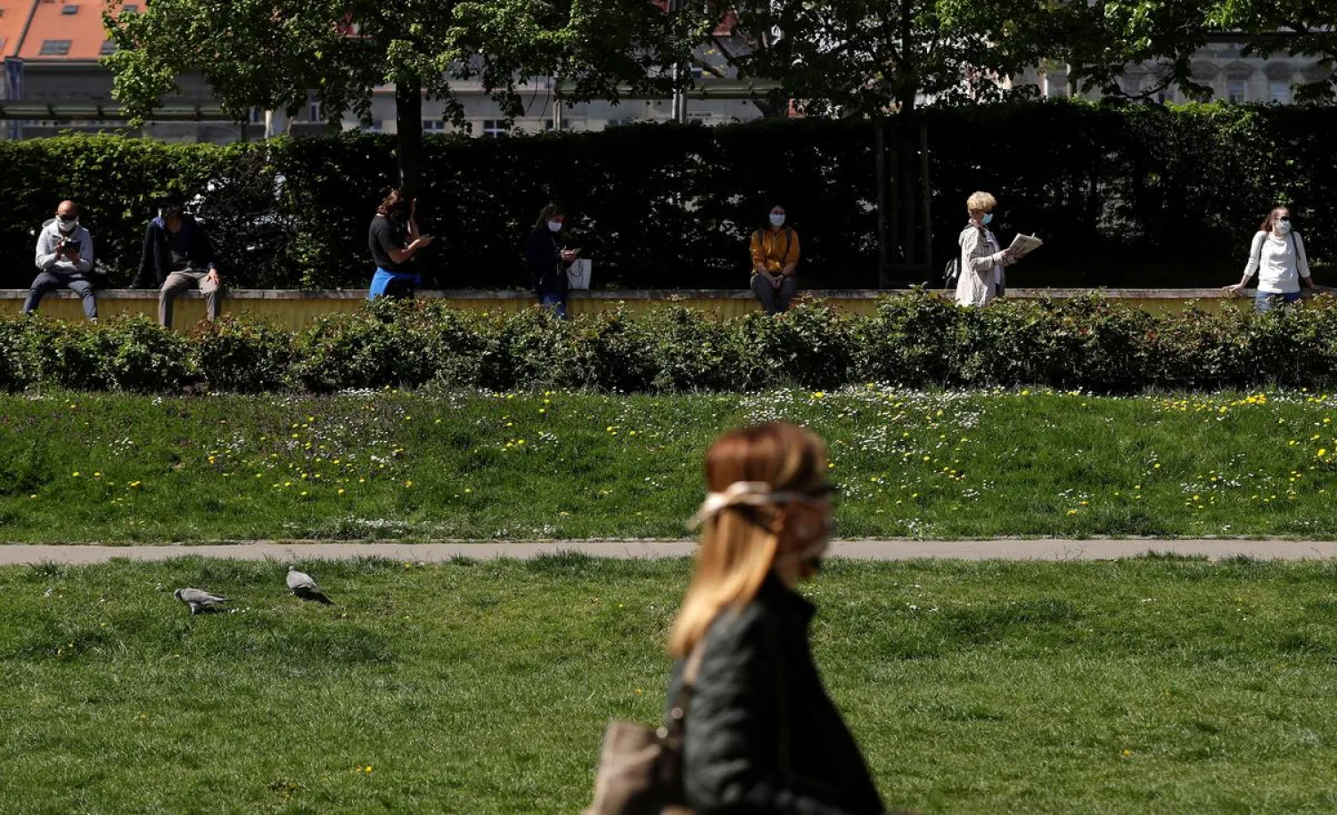 FILE PHOTO: People keep social distance while waiting in line to be tested for the coronavirus disease (COVID-19) as a part of a study about undetected infections with the coronavirus in the population in Prague, Czech Republic, April 23, 2020. REUTERS/David W Cerny
