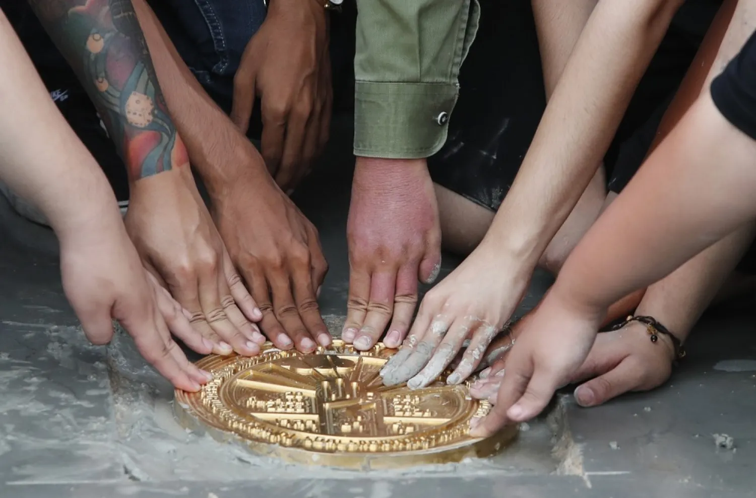 Pro-democracy student leaders install a plaque declaring ‘This country belongs to the people’ at the Sanam Luang field during a protest in Bangkok, Thailand, Sunday, Sept. 20, 2020. (AP)