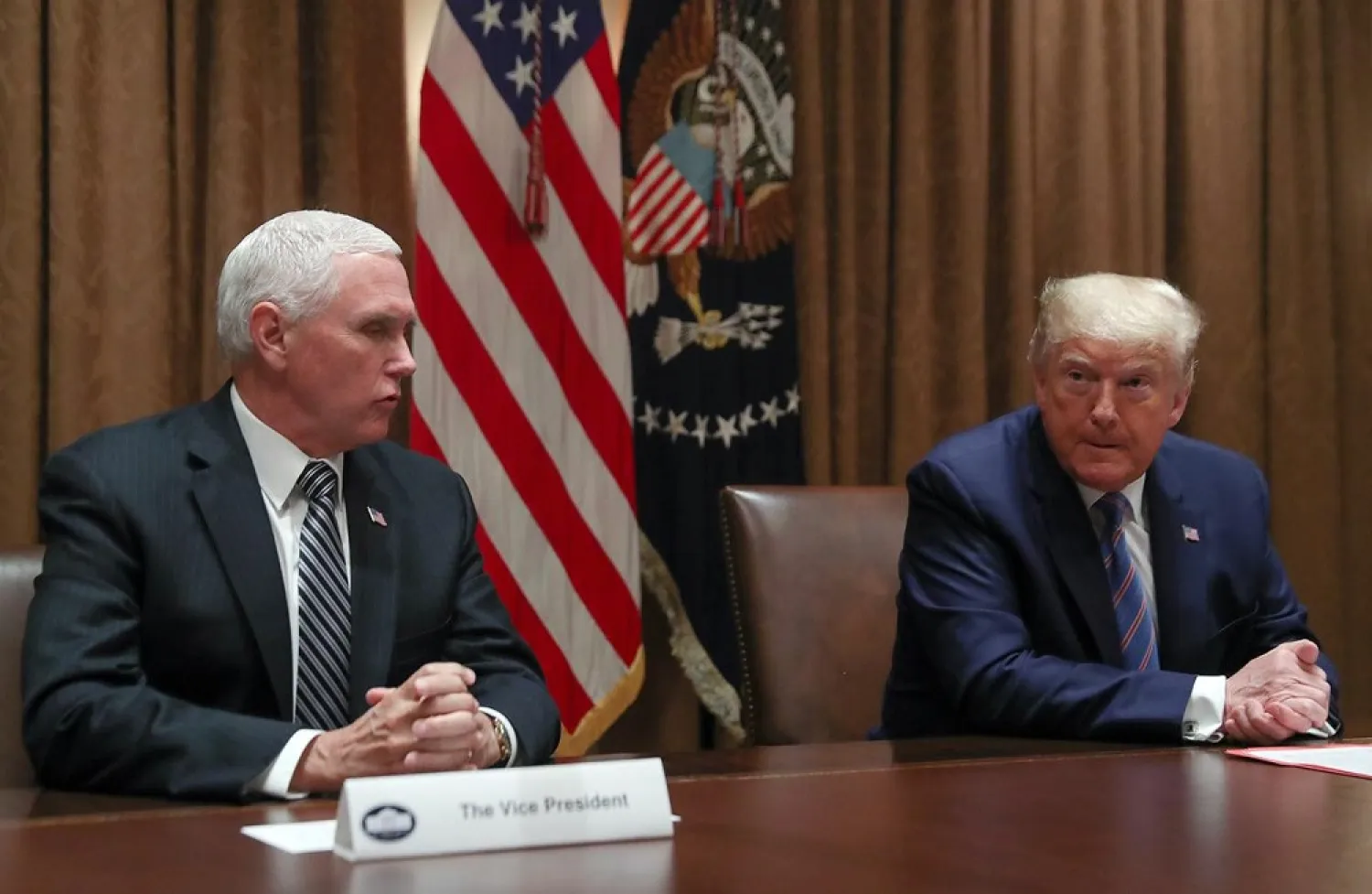 US President Donald Trump listens to Vice President Mike Pence speak during a roundtable discussion on ‘America's seniors’ in the Cabinet Room at the White House in Washington, US, June 15, 2020. (Reuters)