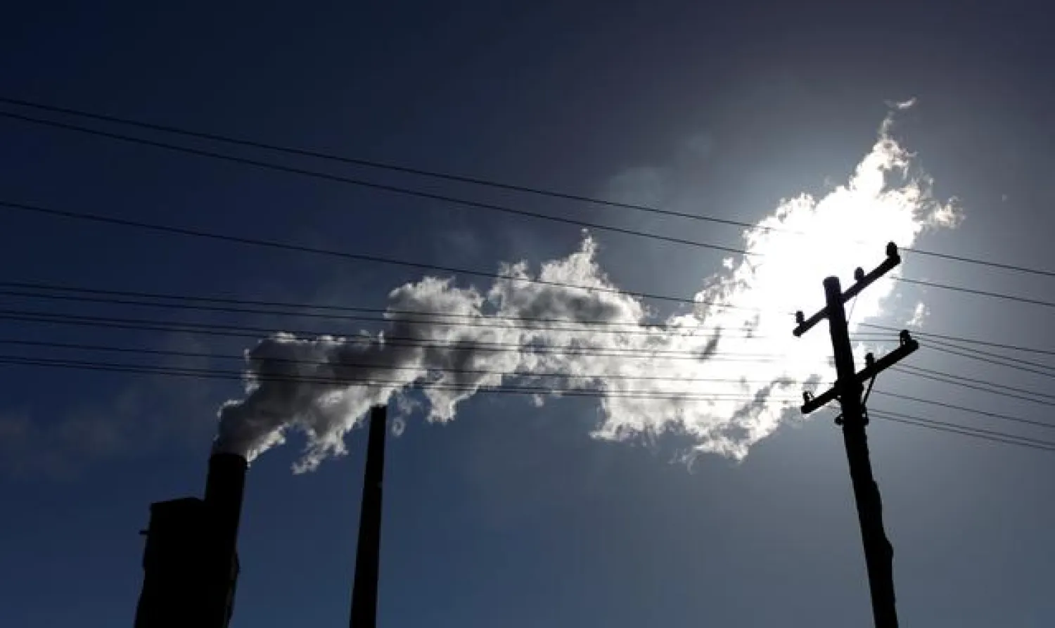 FILE PHOTO: Vapour pours from a steel mill chimney in the industrial town of Port Kembla, about 80 km (50 miles) south of Sydney July 7, 2011. REUTERS/Tim Wimborne/File Photo