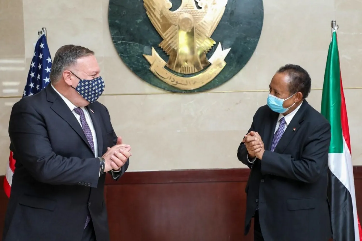 US Secretary of State Mike Pompeo (L) greets Sudanese Prime Minister Abdalla Hamdok in Khartoum on August25, 2020. (AFP)
