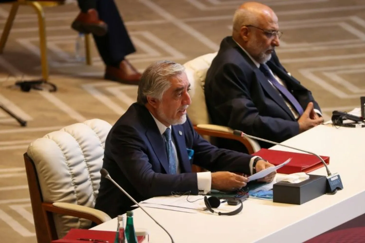Abdullah Abdullah (L), Chairman of Afghanistan's High Council for National Reconciliation, said the level of Taliban attacks in the country is still unacceptably high for peace talks | AFP