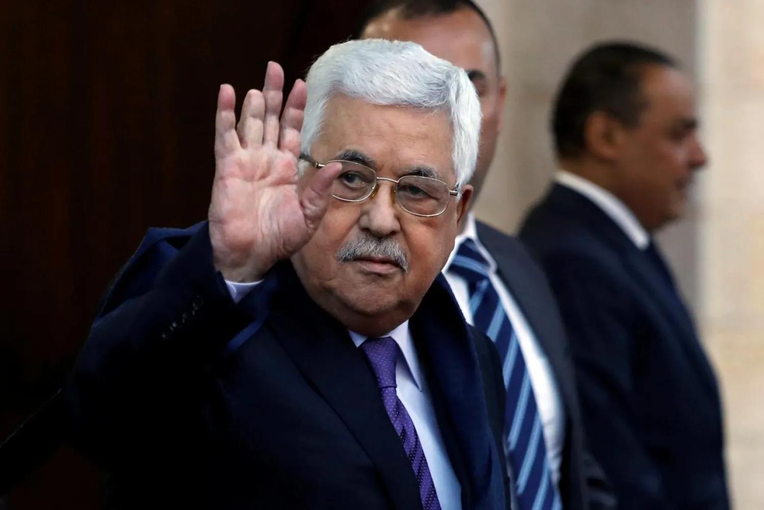 FILE PHOTO: Palestinian President Mahmoud Abbas waves in Ramallah, in the occupied West Bank May 1, 2018. REUTERS/Mohamad Torokman