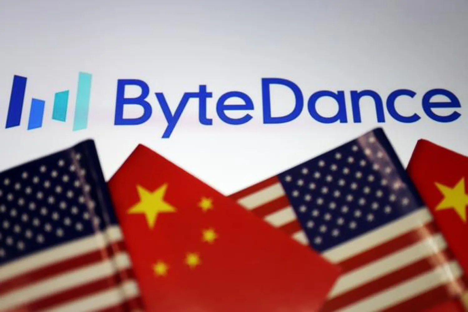 FILE PHOTO: Flags of China and US are seen near a Bytedance logo in this illustration picture taken September 18, 2020. REUTERS/Florence Lo/Illustration
