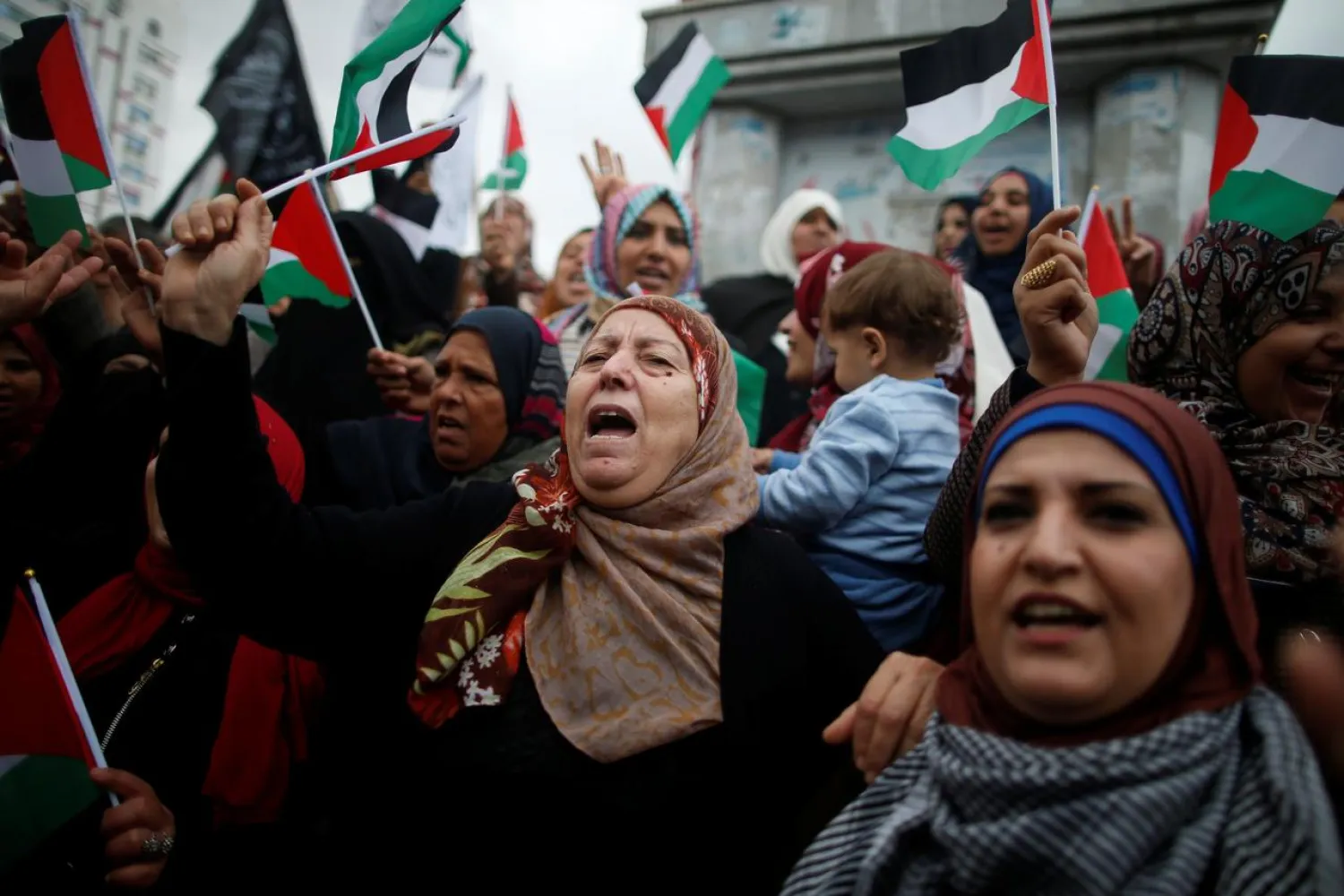 Palestinian women shout slogans during a protest in Gaza City. REUTERS/Mohammed Salem