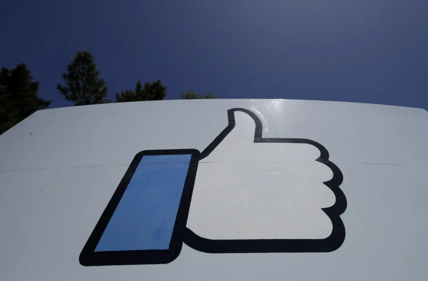 This April 25, 2019, file photo shows the thumbs-up "Like" logo on a sign at Facebook headquarters in Menlo Park, Calif. A group of prominent Facebook critics, including one of the social network's early investors and a journalist facing jail time in the Philippines, are launching their version of an "oversight board" to rival the company's own. The announcement Friday, Sept. 25, 2020 comes a day after Facebook said its own, quasi-independent oversight board, which has faced numerous delays since the company announced its creation in 2018, will launch in October. (AP Photo/Jeff Chiu, File)
