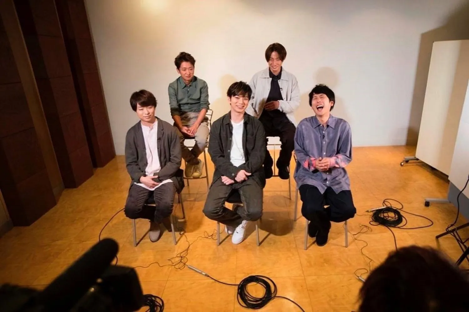Members of Japanese pop music band ARASHI listen to a question during an interview with The Associated Press in Tokyo on Thursday, Sept. 17, 2020. (AP)