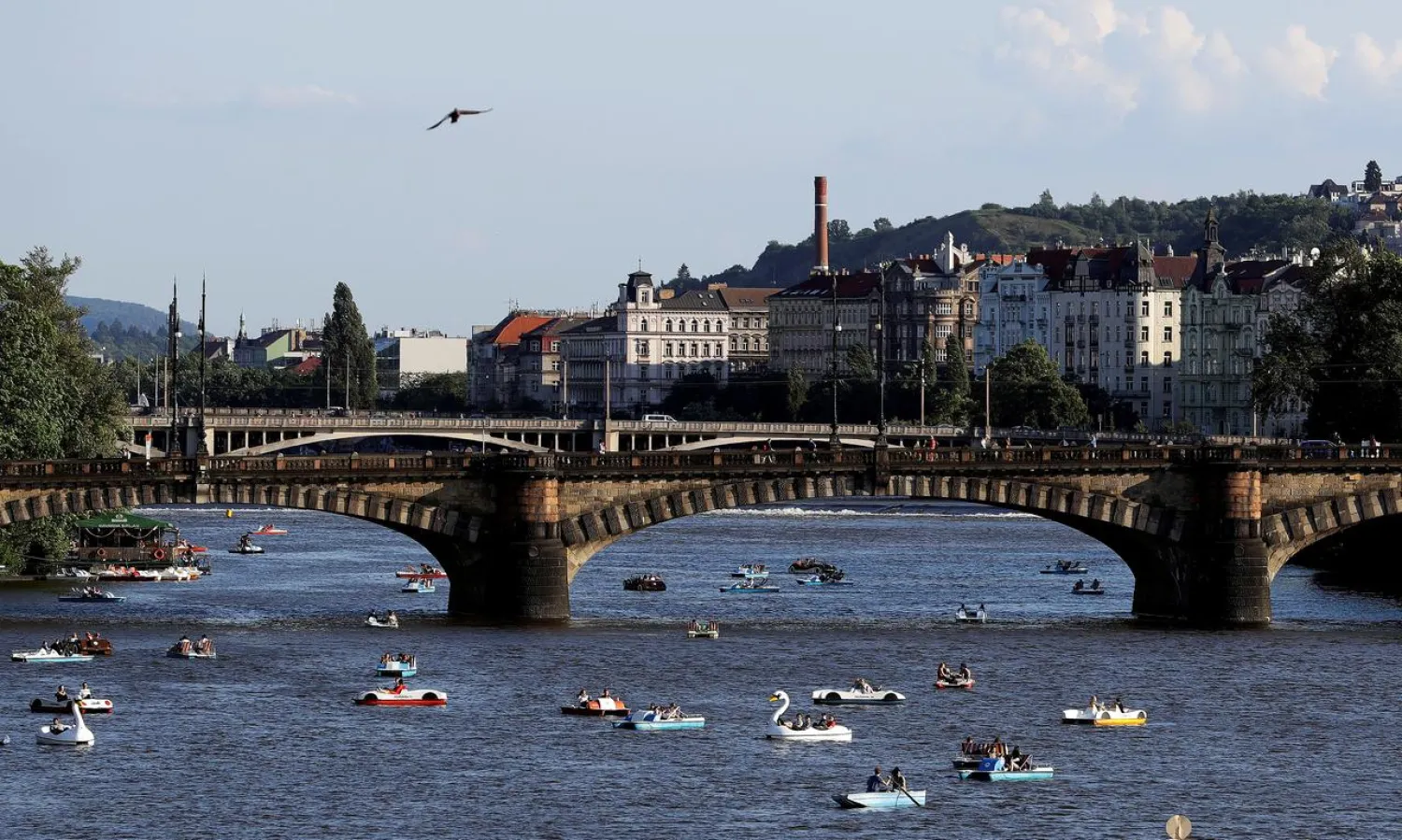 FILE PHOTO: People ride pedal boats on the Vltava river following the coronavirus disease (COVID-19) outbreak, in Prague, Czech Republic, June 22, 2020. REUTERS/David W Cerny/File Photo