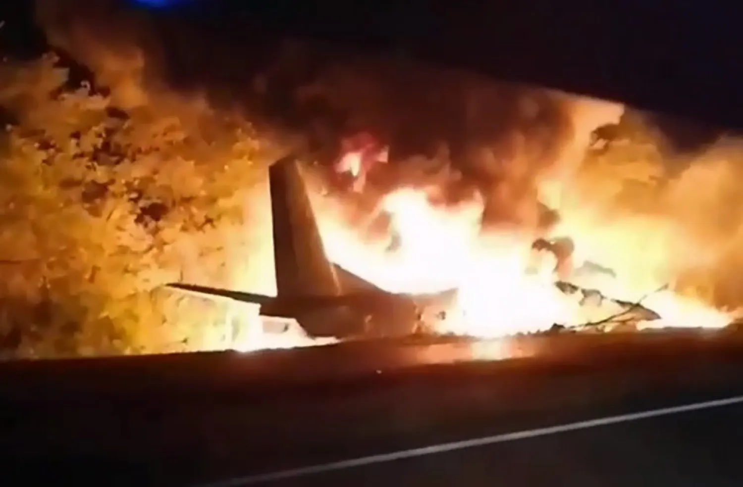 In this TV grab released by Ukraine's Emergency Situation Ministry, an AN-26 military plane bursts into flames after it crashed in the town of Chuguyiv close to Kharkiv, Ukraine, late Friday, Sept. 25, 2020. Among 28 people on board 22 people were killed. (Emergency Situation Ministry via AP)
