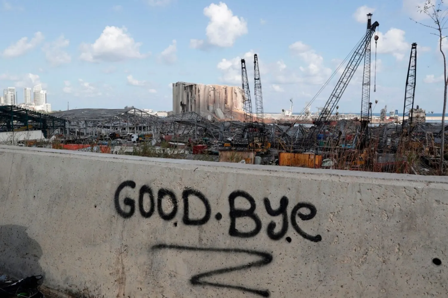 A picture taken on Aug. 9 shows graffiti on the wall of a bridge overlooking the devastated port of Beirut. (Getty Images)