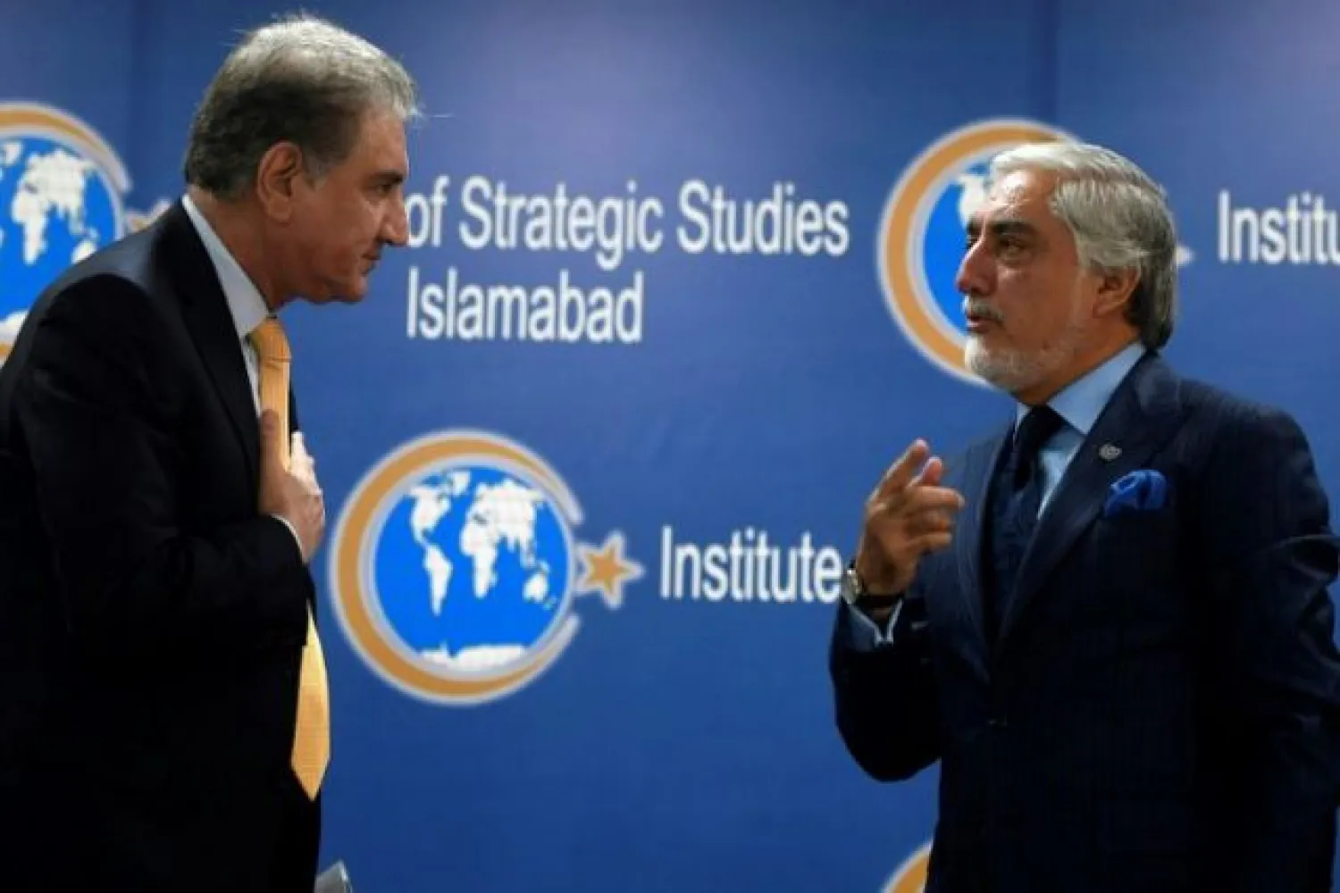 Pakistan's Foreign Minister Shah Mahmood Qureshi (left) listens to Chairman of the High Council for National Reconciliation of Afghanistan Abdullah Abdullah at an Institute of Strategic Studies meeting in Islamabad | AFP
