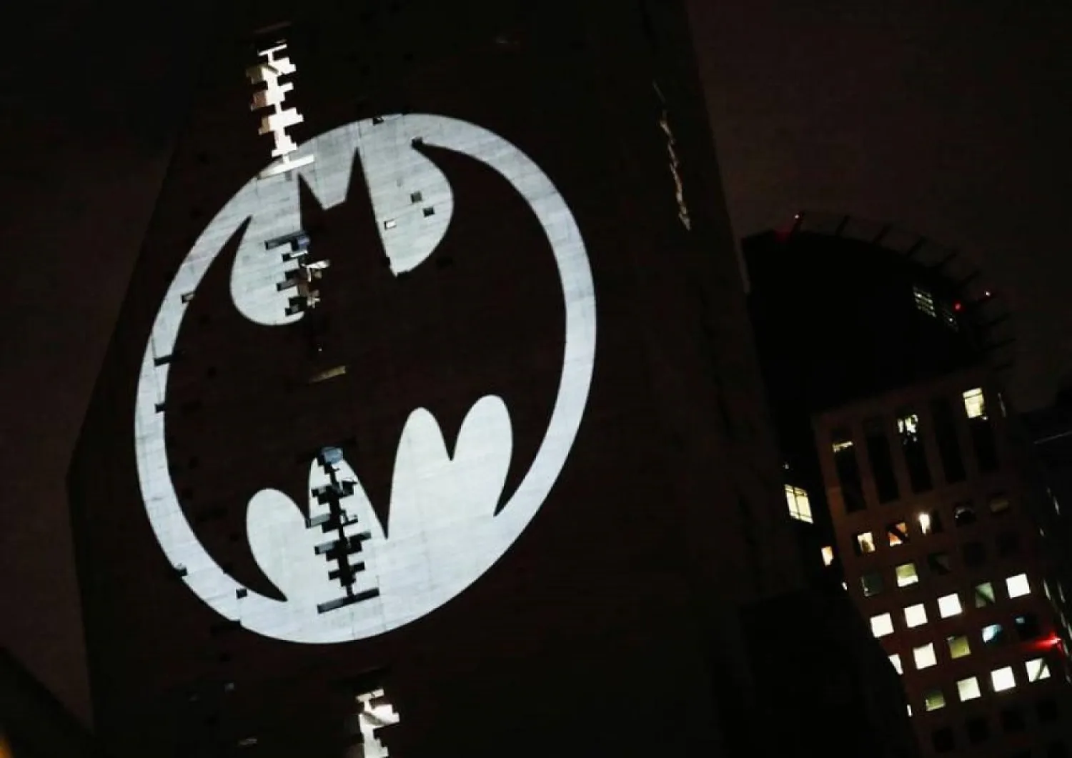 A Bat-Signal is projected onto a building at night as Batman fans celebrate the 80th anniversary of the first appearance of the DC Comics superhero, in Mexico City, Mexico September 21, 2019. (Reuters)