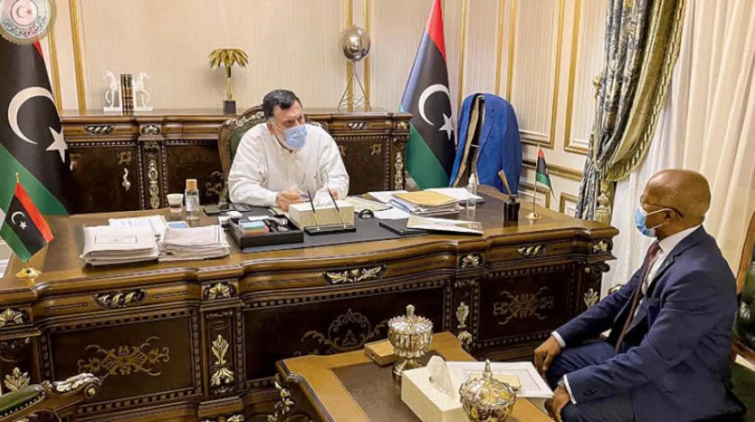 Serrac, UMH’ye bağlı Çalışma Bakanı Mehdi el-Emin ile (Başkanlık Konseyi)