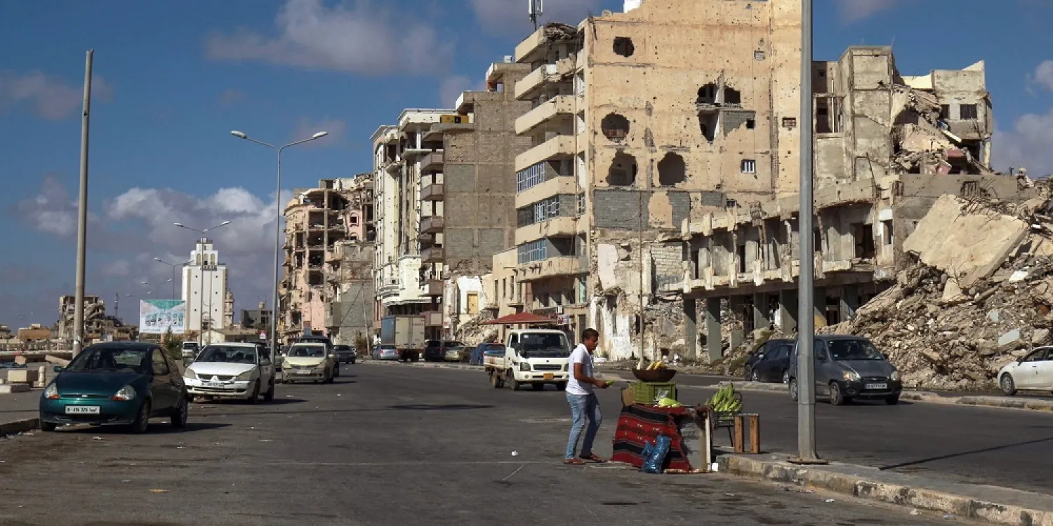 A Libyan street vendor sells corn on the roadside by the waterfront promenade in the eastern port city of Benghazi, June 22, 2020. (AFP)