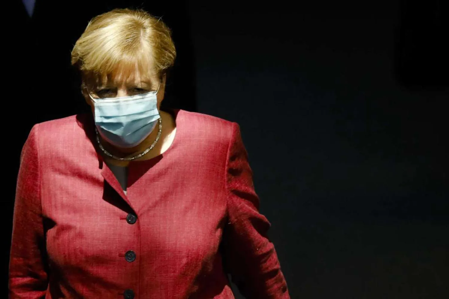 German Chancellor Angela Merkel arrives for a debate about her policy as part of Germany's budget 2021 debate at the parliament Bundestag in Berlin, Germany, Wednesday, Sept. 30, 2020. (AP Photo/Markus Schreiber)