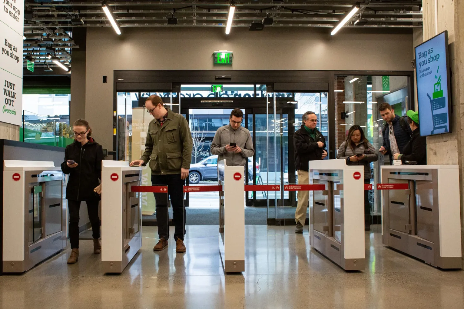 Shoppers scan their phones to enter Amazon Go Grocery on February 26, 2020 in Seattle, Washington. AFP/David Ryder