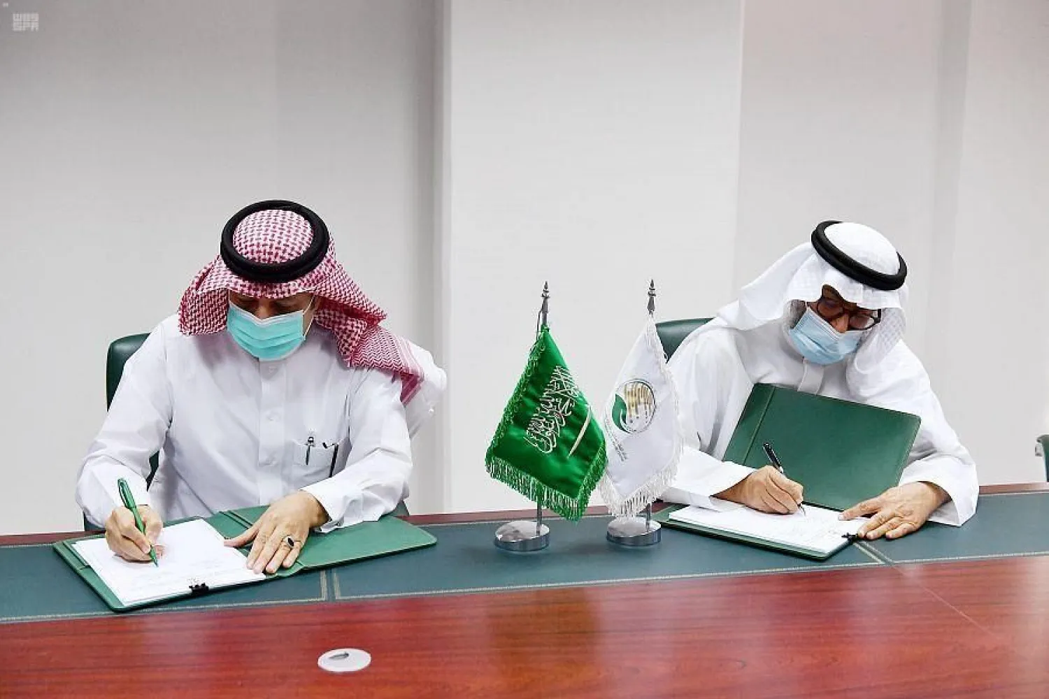 KSrelief's assistant supervisor general for planning and development Dr. Aqeel bin Jamaan al-Ghamdi and secretary general of al-Basar international foundation Dr. Adel bin Abdulaziz al-Rashoud. SPA