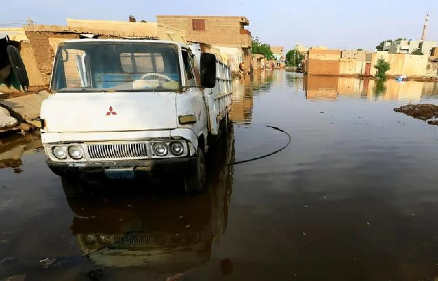 A truck is seen in the waters of the Blue Nile floods within the Al-Ikmayr area of Omdurman in Khartoum, Sudan August 27, 2020. REUTERS/Mohamed Nureldin Abdallah