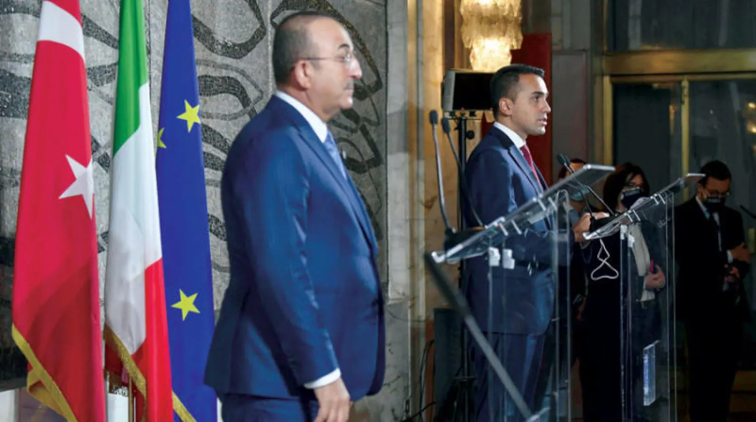 وزير الخارجية التركي في مؤتمر صحافي مع نظيره الإيطالي (أ.ب)