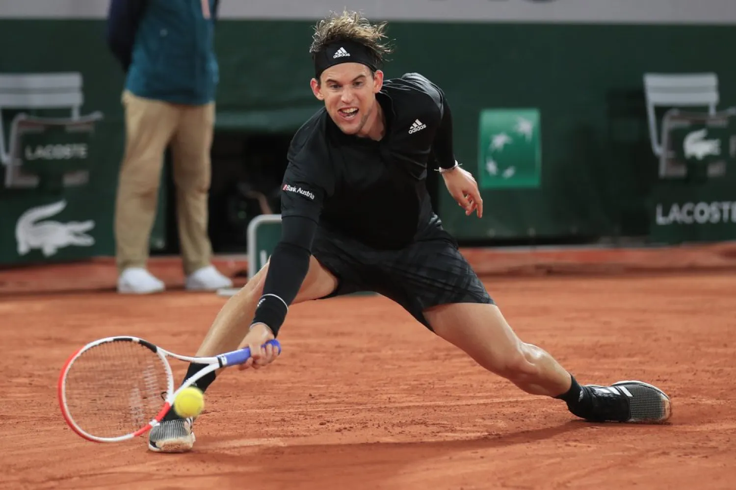 Dominic Thiem plays a shot against Casper Ruud in the third round match of the French Open tennis tournament at the Roland Garros stadium in Paris, France, Oct. 2, 2020. (AP)