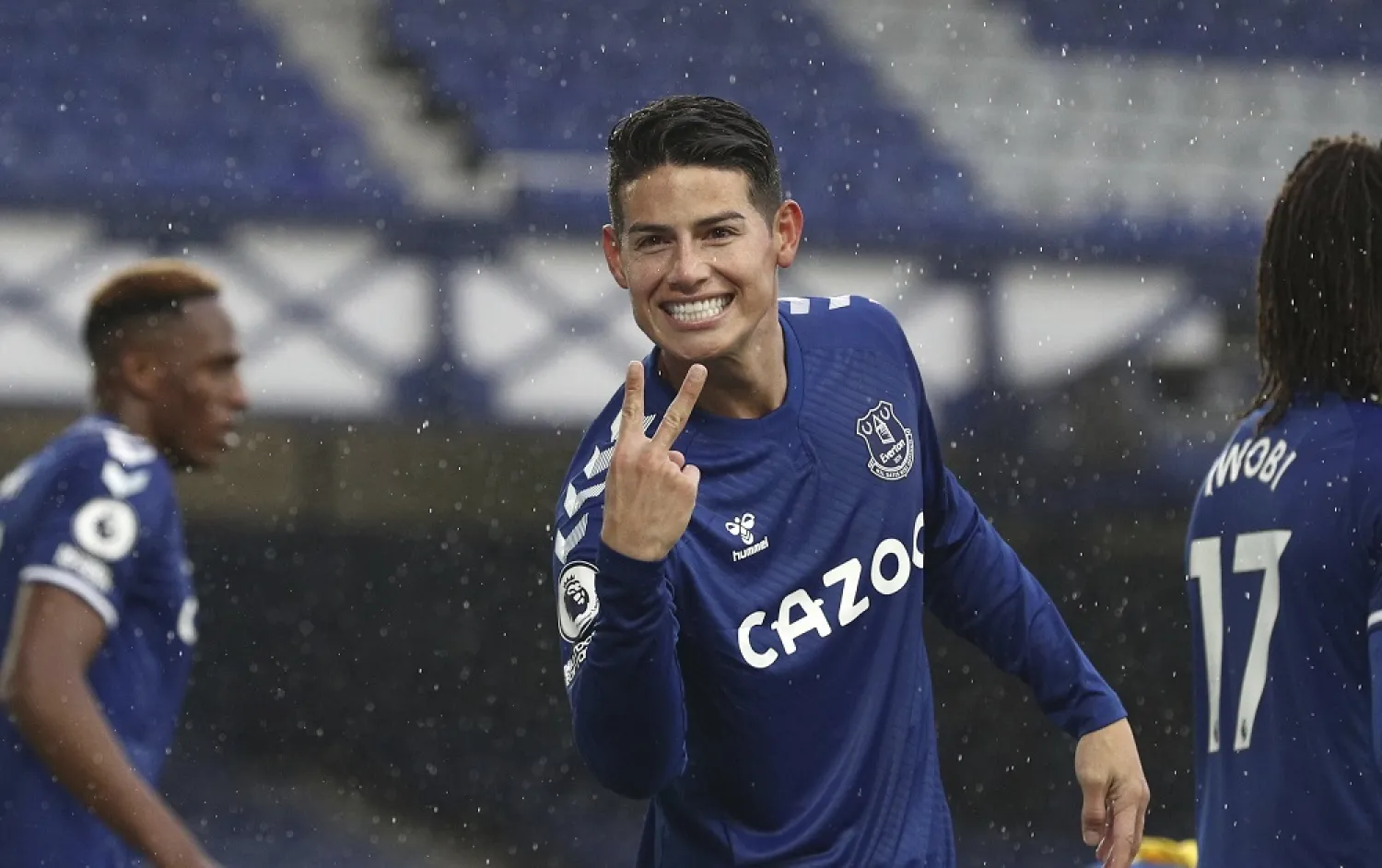 Everton's James Rodriguez celebrates after scoring his side's fourth goal during the Premier League match against Brighton at the Goodison Park stadium in Liverpool, England, Oct. 3, 2020. (AP)