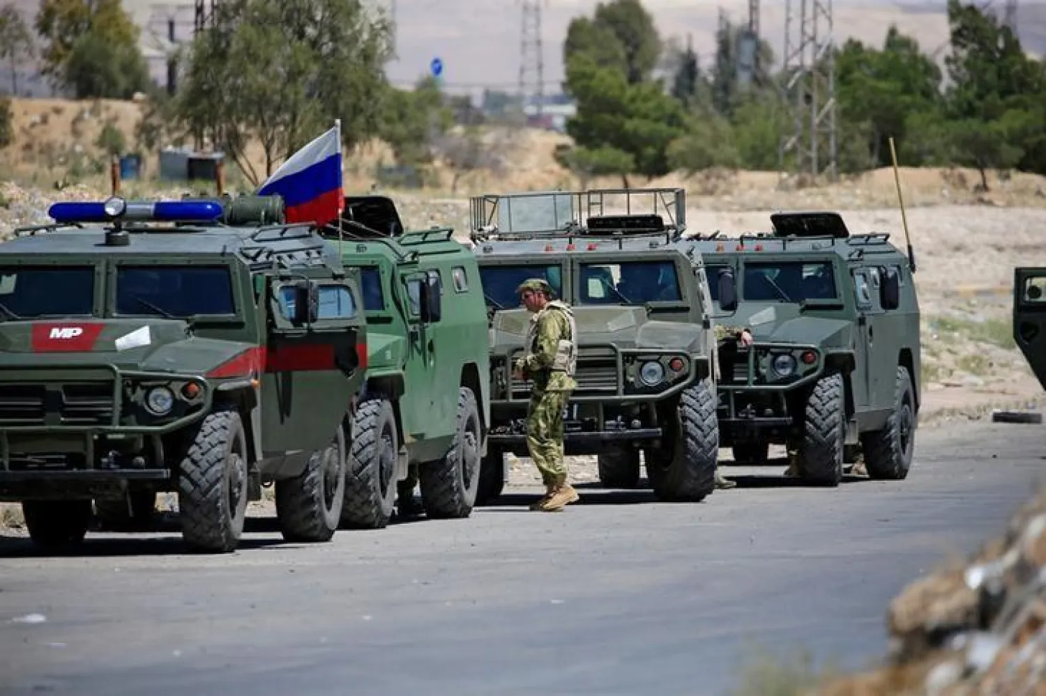 Russian military vehicles are seen in eastern Ghouta near Douma, in Damascus (Reuters)
