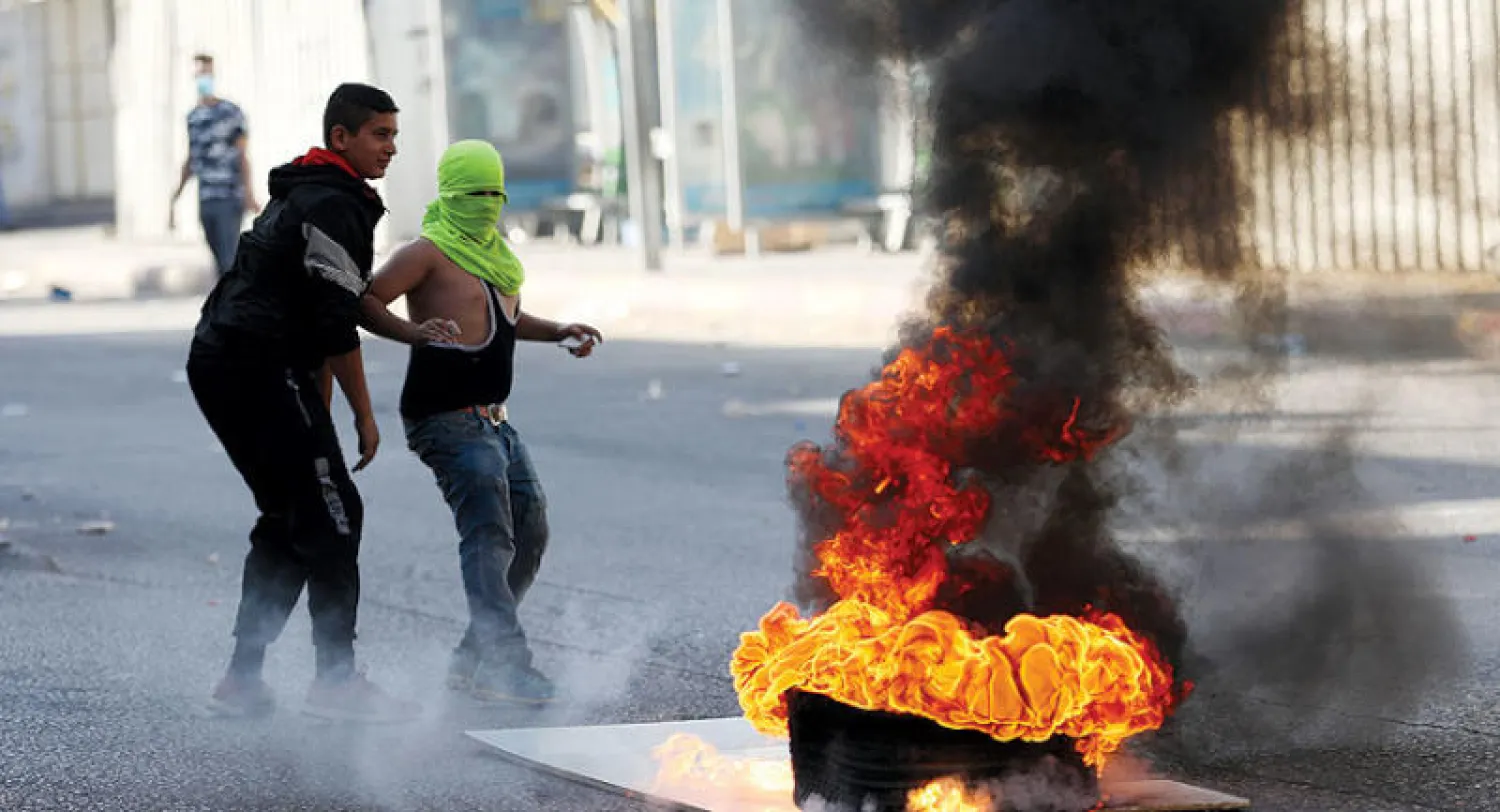 احتجاجات فلسطينية في الخليل ضد الاستيطان الإسرائيلي (إ.ب.أ)