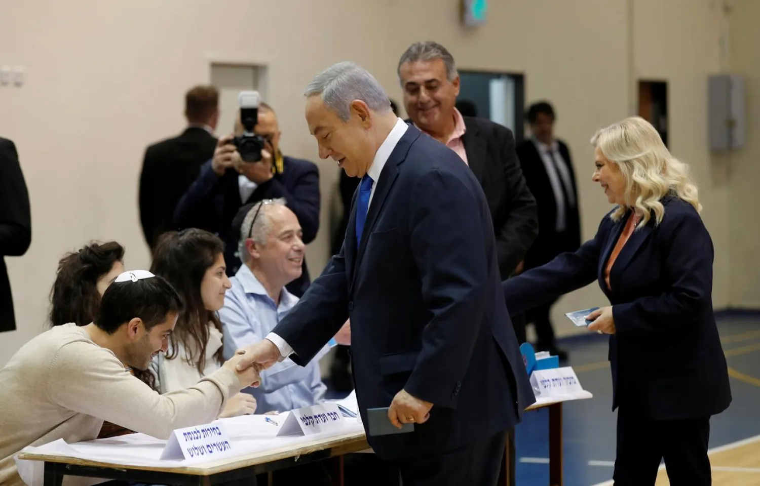 Israeli Prime Minister Benjamin Netanyahu and his wife Sara Netanyahu are seen during the Israeli parliamentary elections at a polling station in Jerusalem, March 2, 2020. Atef Safadi/Pool via REUTERS