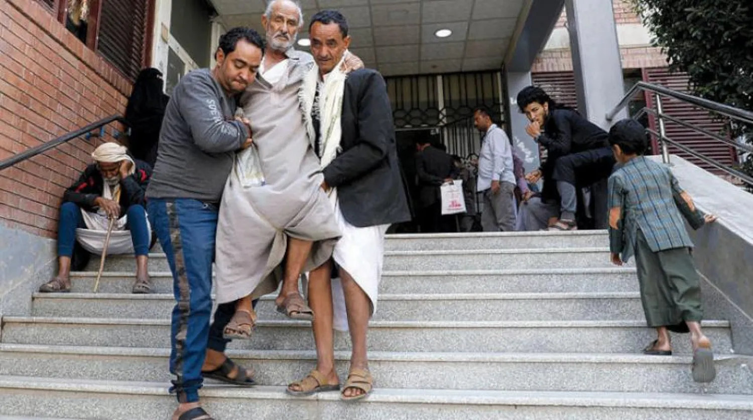Patients in front of Al-Thawra Hospital in Sanaa. (Reuters)