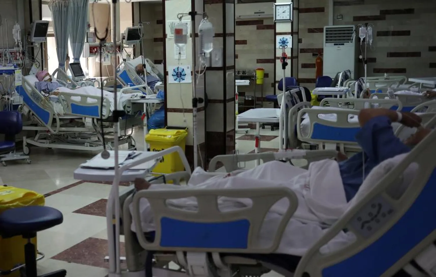 Patients with coronavirus disease (COVID-19) lie in beds at the ICU of Sasan Hospital, in Tehran, Iran March 30, 2020. WANA (West Asia News Agency)/Ali Khara via REUTERS
