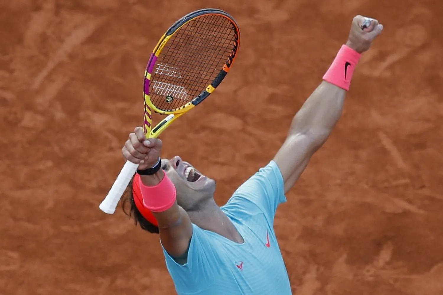 Rafael Nadal celebrates winning the semifinal match of the French Open tennis tournament against Diego Schwartzman at the Roland Garros stadium in Paris, France, Oct. 9, 2020. (AP)